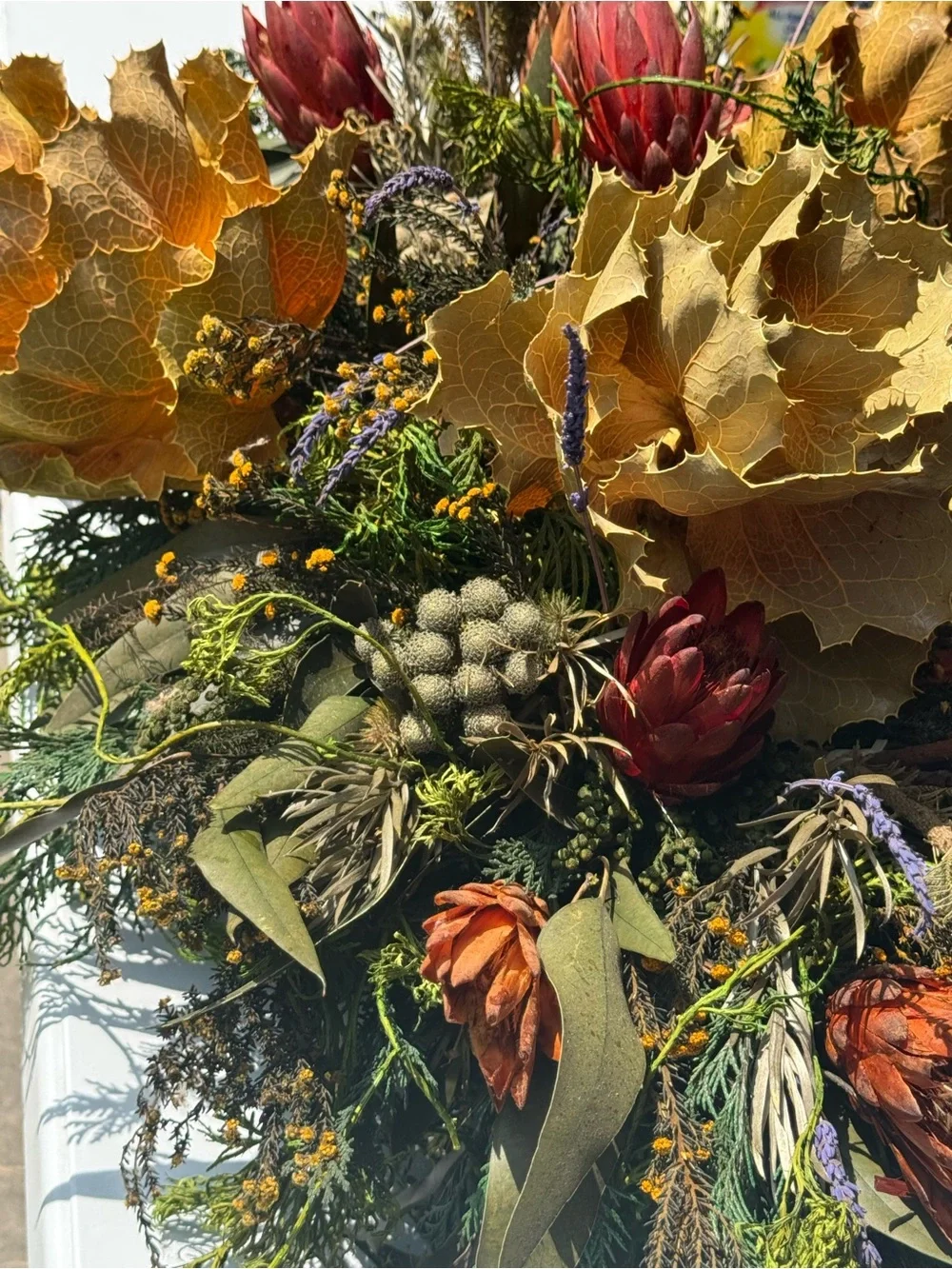 Autumn table center piece or decoration floral leaves full in planter box